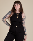 Sydney is 5’9” and wearing XXS Racerback Tank in Black