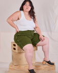 Ashley is wearing Railroad Carpenter Shorts in Summer Olive and Cropped Tank in Vintage Tee Off-White