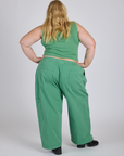 Back view of Drop Pocket Cargo Pants in Seafoam Green and matching Muscle Tee on Juliet