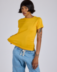 Kira is 5’10” and wearing P Jr. Varsity Tee in Sunshine Yellow