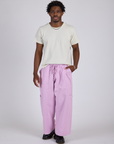Isaac is 5’10” and wearing M Drop Pocket Cargo Pants in Lilac Purple paired with Organic Vintage Tee in Vintage Tee White