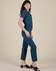 Side view of Short Sleeve Jumpsuit in Lagoon on Alex