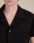 Short Sleeve Jumpsuit in Basic Black front close up on Quinn