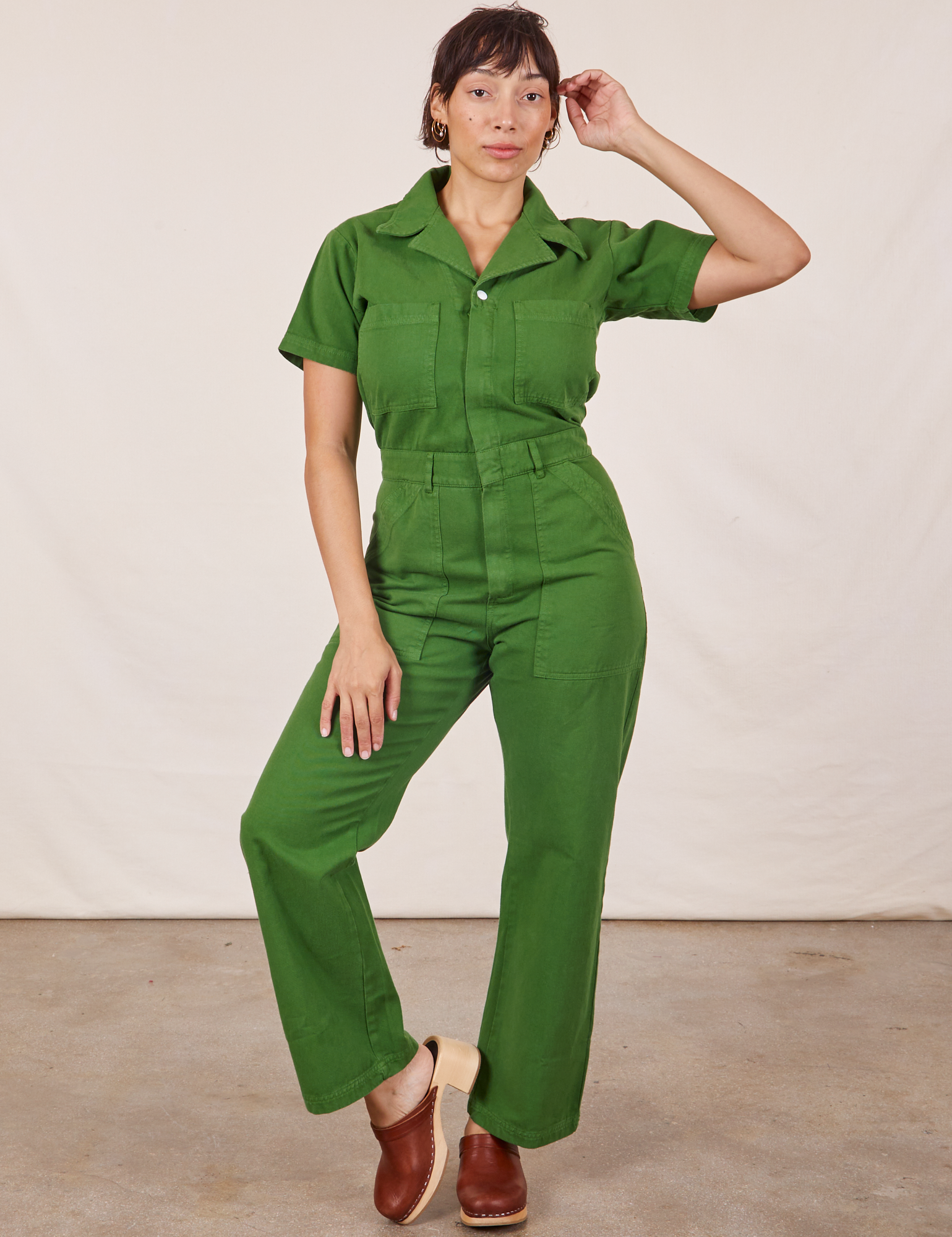Tiara is 5&#39;4&quot; and wearing S Short Sleeve Jumpsuit in Lawn Green