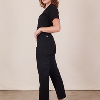 Side view of Short Sleeve Jumpsuit in Basic Black worn by Alex