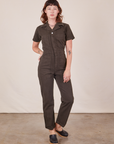 Alex is wearing Short Sleeve Jumpsuit in Espresso Brown