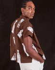 Soda Bottle Pantry Button-Up in Fudgesicle Brown angled back view on Jerrod