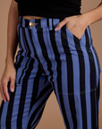 Close up of Tiara's hand in the front pocket of Black Stripe Work Pants in Cornflower Blue