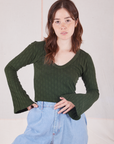 Hana is 5'3" and wearing P Bell Sleeve Top in Swamp Green