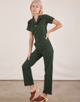 Madeline is wearing Short Sleeve Jumpsuit in Swamp Green