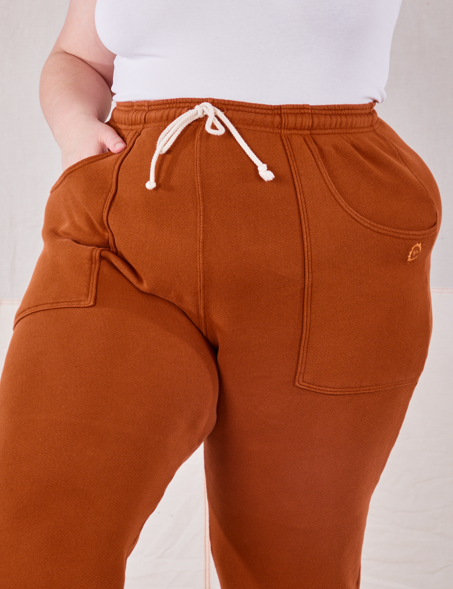 Rolled Cuff Sweat Pants in Burnt Terracotta close up on Marielena