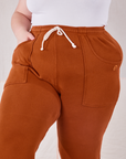 Rolled Cuff Sweat Pants in Burnt Terracotta close up on Marielena