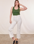 Allison is wearing XXS Tank Top in Dark Emerald Green paired with vintage tee off-white Western Pants
