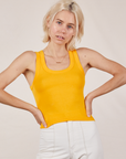 Madeline is 5'9" and wearing P Tank Top in Sunshine Yellow