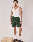 Jesse is 5’8” and wearing XS Trouser Shorts in Swamp Green paired with a Tank Top in vintage tee off-white