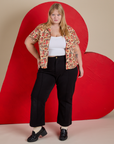 Juliet is wearing Hot Stuff Print Pantry Button-Up and black Western Pants
