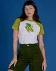 Alex is wearing Produce Raglan Tee in Snap Peas