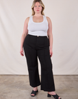 Lish is 5'8" and wearing XL Western Pants in Basic Black paired with a Cropped Tank in Vintage Tee Off-White