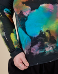 Long Sleeve Baby Tee in Rainbow Magic Waters bottom close up on Ashley