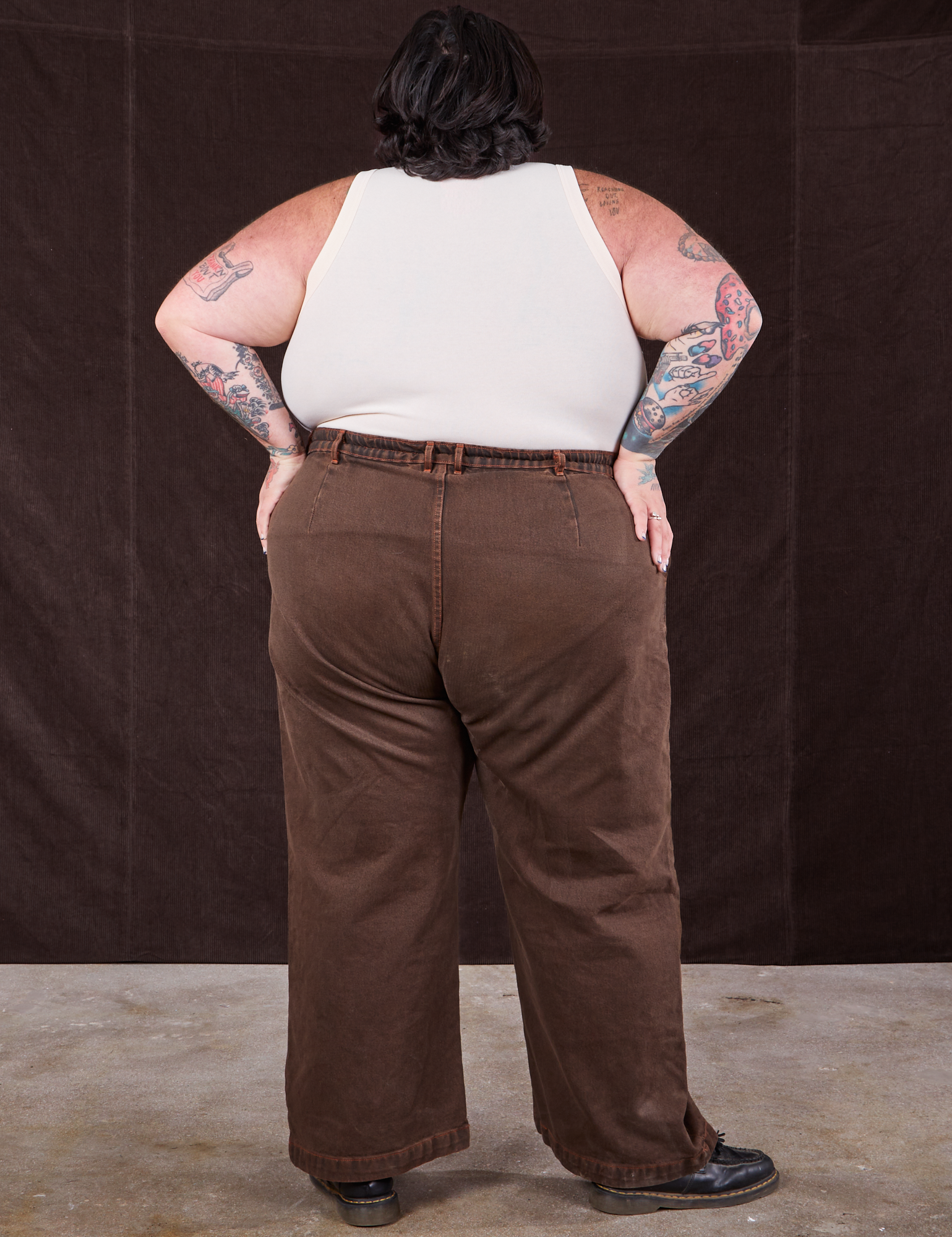 Back view of Overdyed Wide Leg Trousers in Brown and vintage off-white Tank Top on Sam