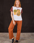 Tiara is wearing Anniversary Tee in Fast Food and burnt terracotta Work Pants