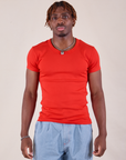 Issac is 5'10" and wearing L Baby Tee in Mustang Red