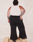 Back view of Bell Bottoms in Basic Black and Tank Top in vintage tee off-white on Sam