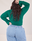 Back view of Bell Sleeve Top in Hunter Green and light wash Trouser Jeans worn by Ashley