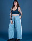 Angled front view of Painted Drop Pocket Cargo Pants in Baby Blue and lagoon Mini Tank on Sydney