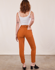Back view of Pencil Pants in Burnt Terracotta and Cropped Cami in vintage tee off-white on Alex
