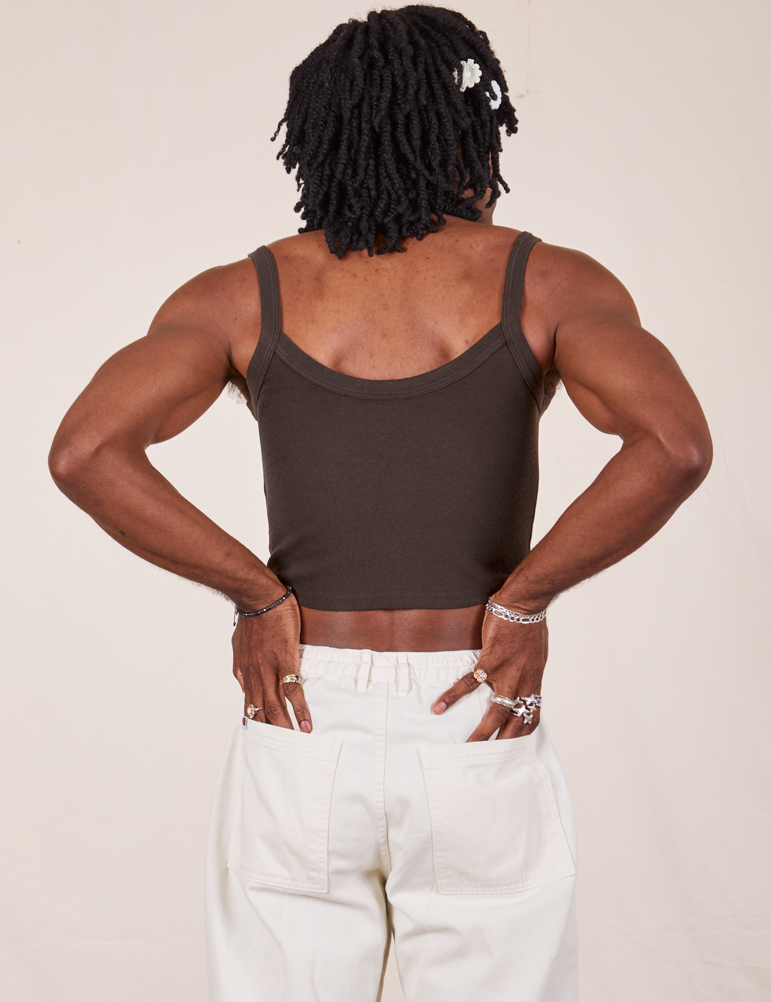 Back view of Cropped Cami in Espresso Brown and vintage off-white Western Pants worn by Jerrod