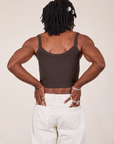 Back view of Cropped Cami in Espresso Brown and vintage off-white Western Pants worn by Jerrod