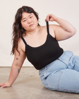Ashley is wearing Cropped Cami in Basic Black and light wash Carpenter Jeans