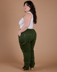 Carpenter Jeans in Evergreen angled back view on Ashley
