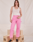 Allison is 5'10" and wearing S Carpenter Jeans in Bubblegum Pink  paired with vintage off-white Tank Top