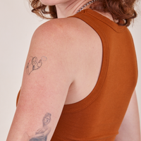 Side view of Cropped Tank Top in Burnt Terracotta worn by Alex