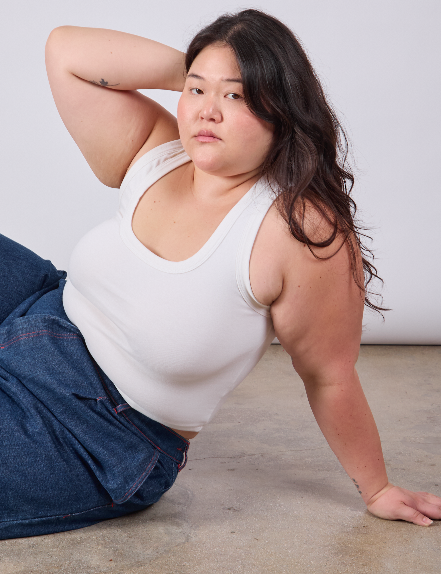 Ashley is wearing Cropped Tank Top in Vintage Tee White