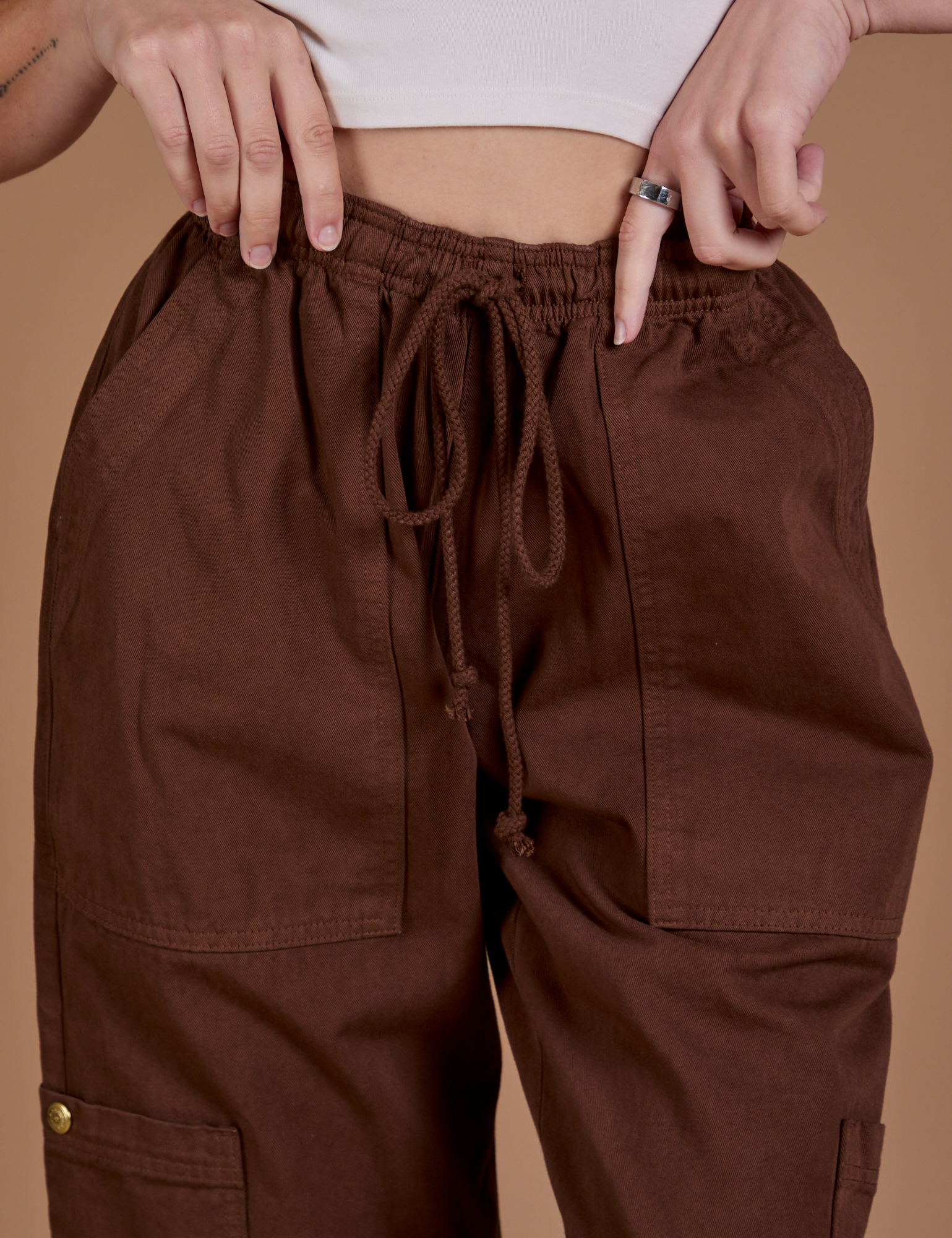 Drop Pocket Cargo Pants in Fudgesicle Brown front close up on Alex