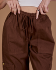 Drop Pocket Cargo Pants in Fudgesicle Brown front close up on Alex