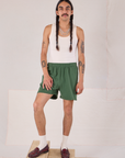 Anthony is 5’10 and wearing M Easy Shorts in Dark Emerald Green paired with a Tank Top in vintage tee off-white