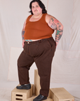 Angled view of Overdyed Denim Trouser in Fudge and burnt terracotta Cropped Tank