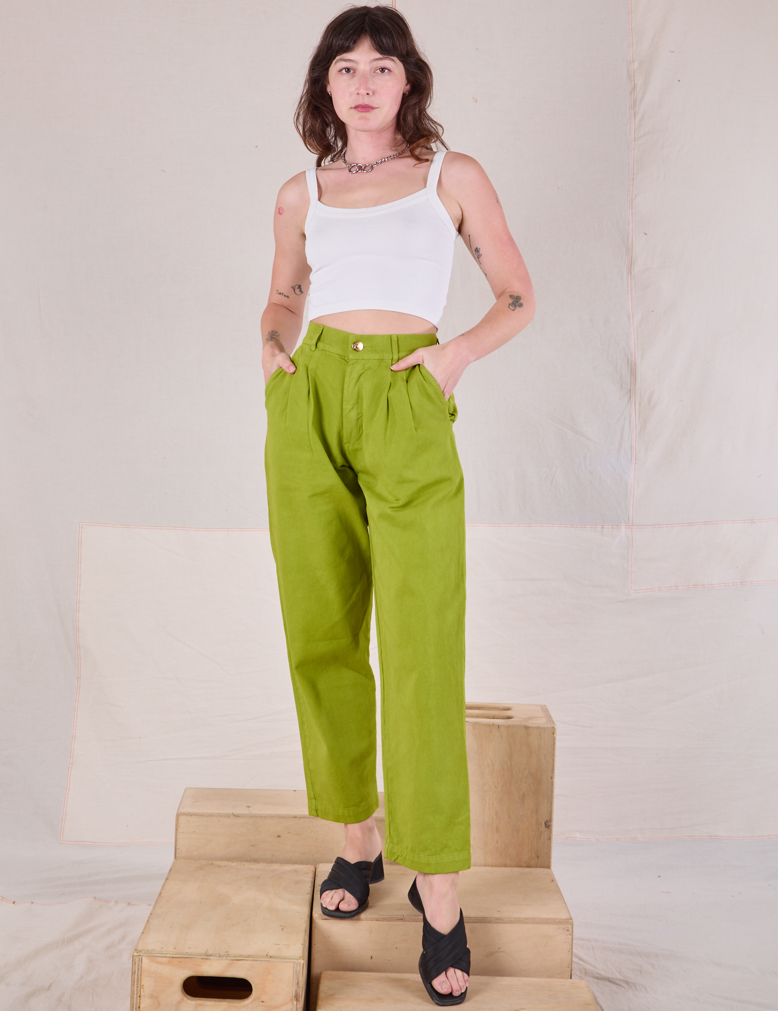 Alex is wearing Heavyweight Trousers in Gross Green and vintage tee off-white Cami