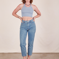 Alex is wearing Halter Top in Periwinkle and light wash Frontier Jeans