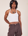 Jerrod is 6'3" and wearing XS Halter Top in Vintage Tee Off-White paired with espresso brown Western Pants