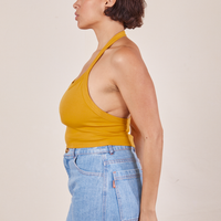Side view of Halter Top in Mustard Yellow worn by Tiara