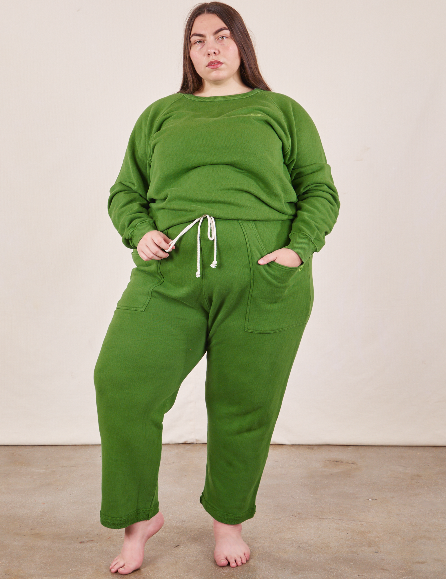 Marielena is wearing Heavyweight Crew in Lawn Green and matching Cropped Rolled Cuff Sweatpants