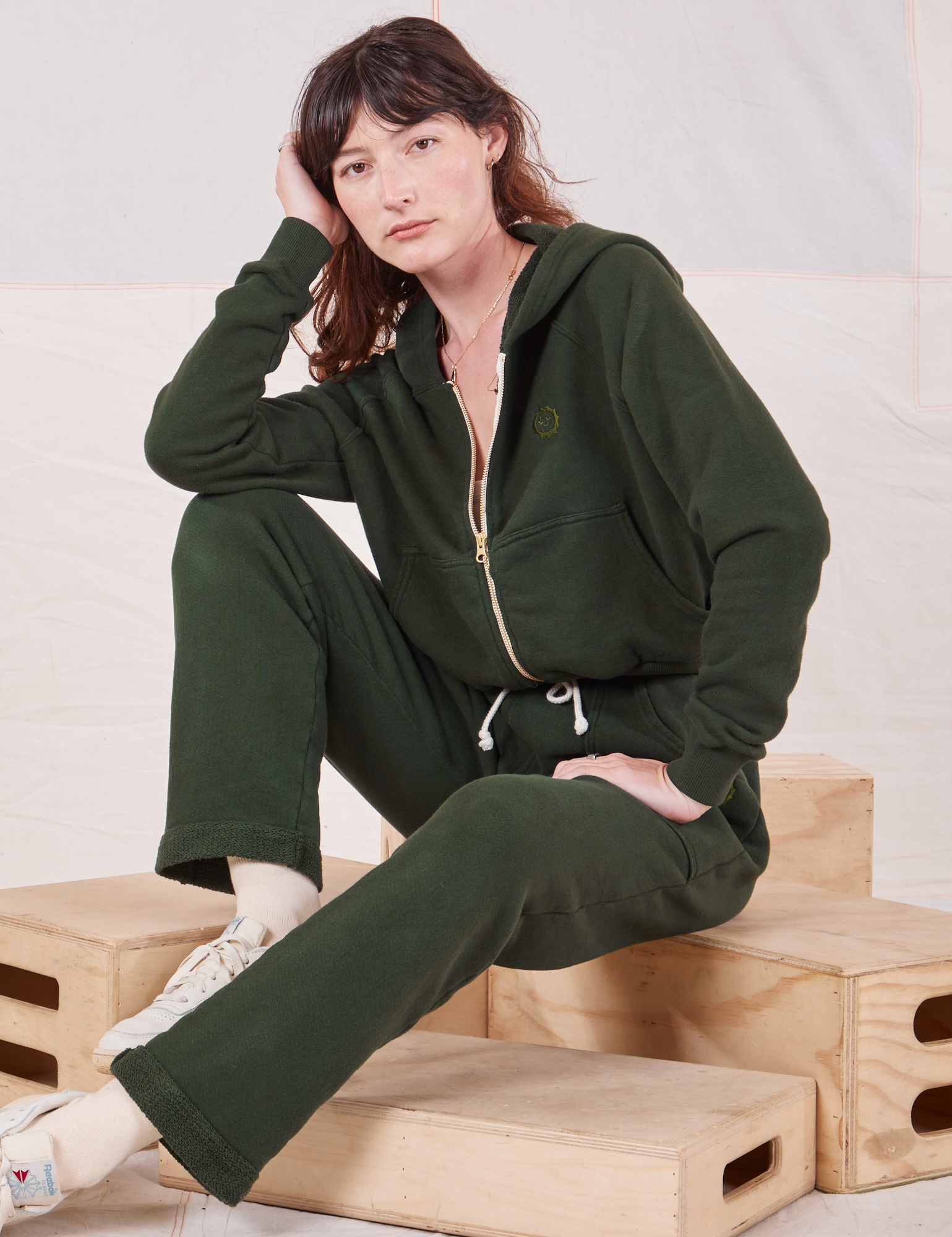 Alex is wearing Cropped Zip Hoodie in Swamp Green and matching Rolled Cuff Sweat Pants