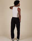Back view of Heavyweight Trousers in Basic Black and Tank Top in Vintage Tee Off-White