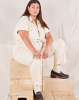 Katie is wearing Heritage Short Sleeve Jumpsuit in Natural