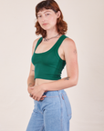 Angled view of Cropped Tank Top in Hunter Green on Alex